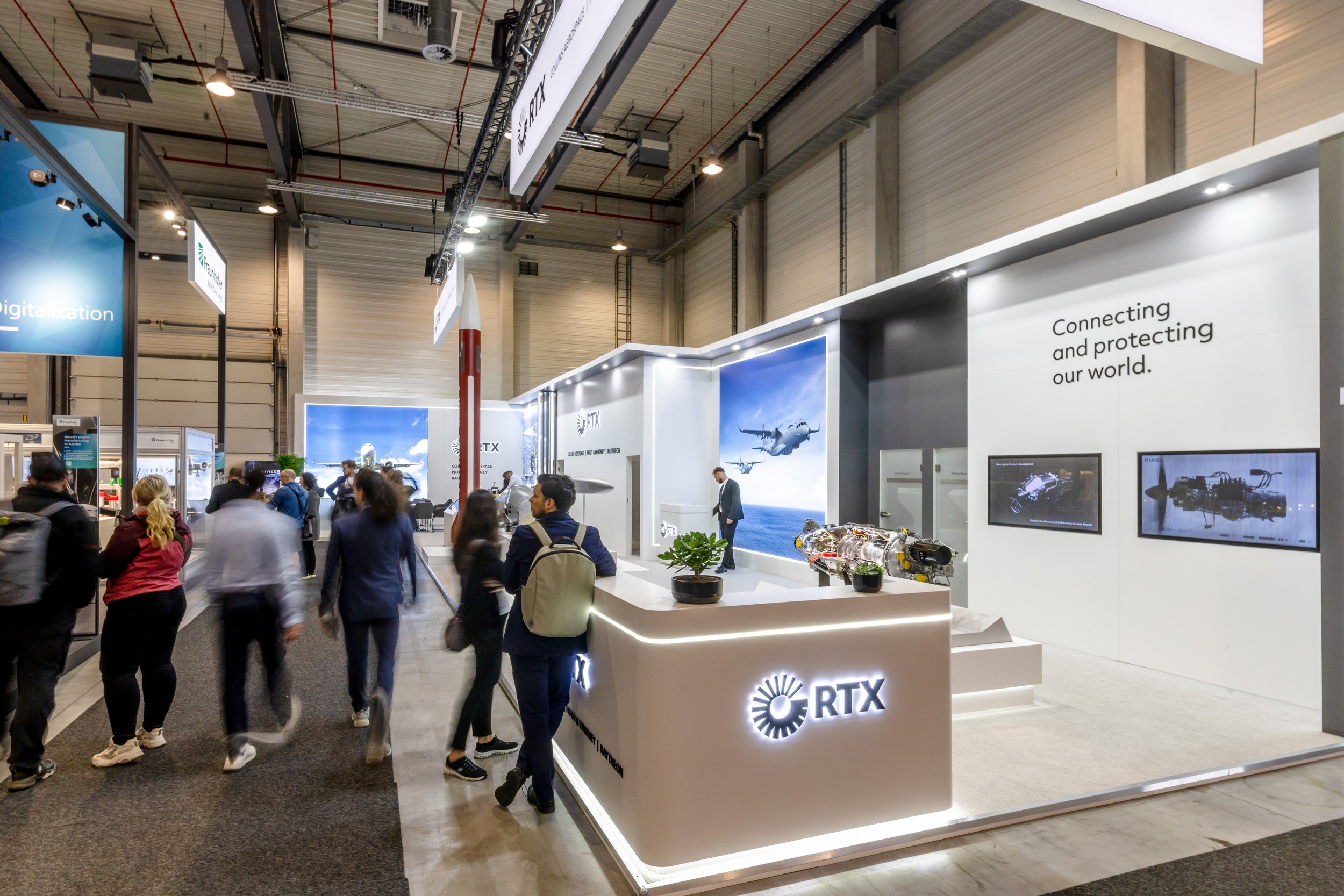 The RTX stand opens on two sides towards the aisles.