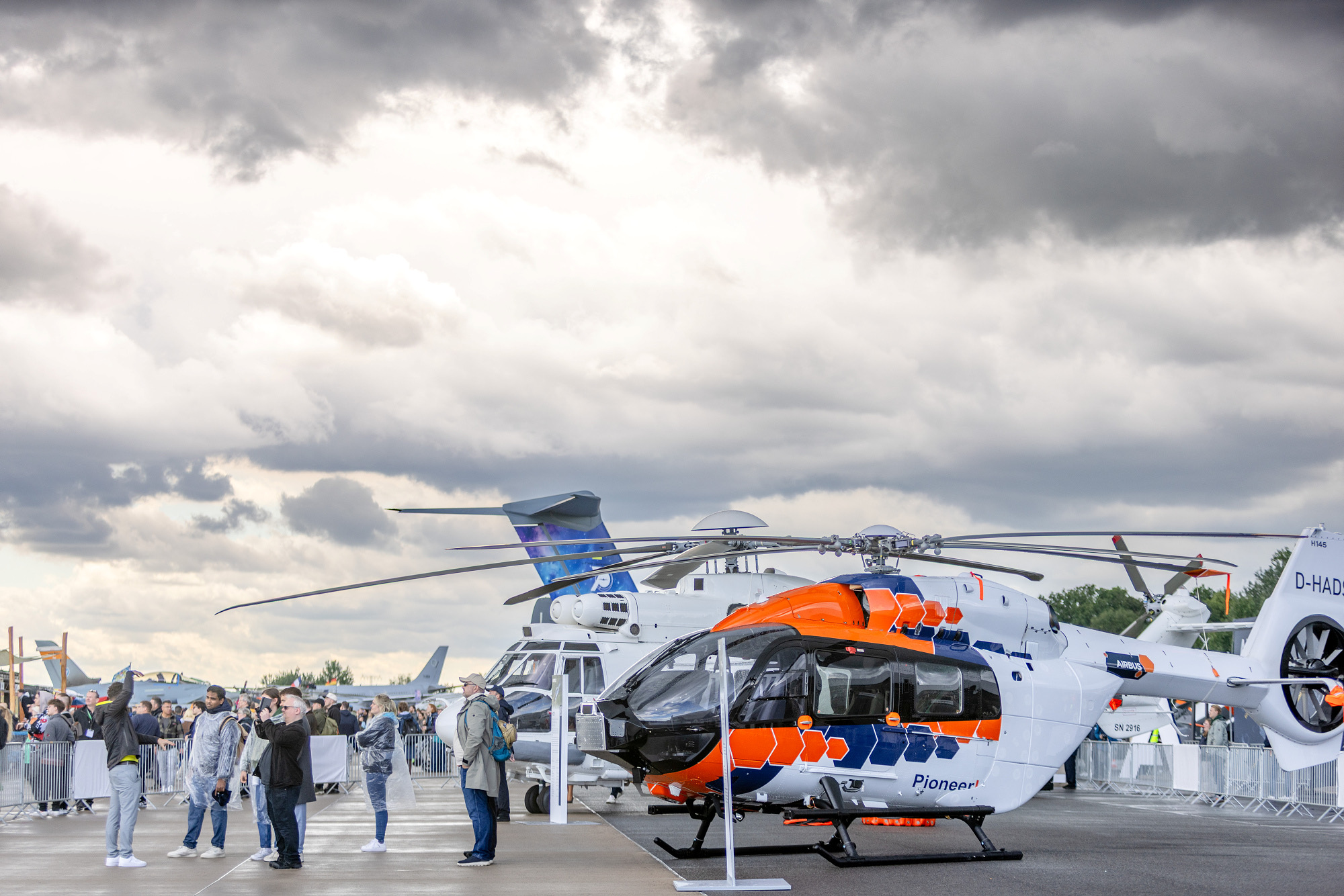 Airbus H145 PioneerLab in front of a row of visitors in the static display