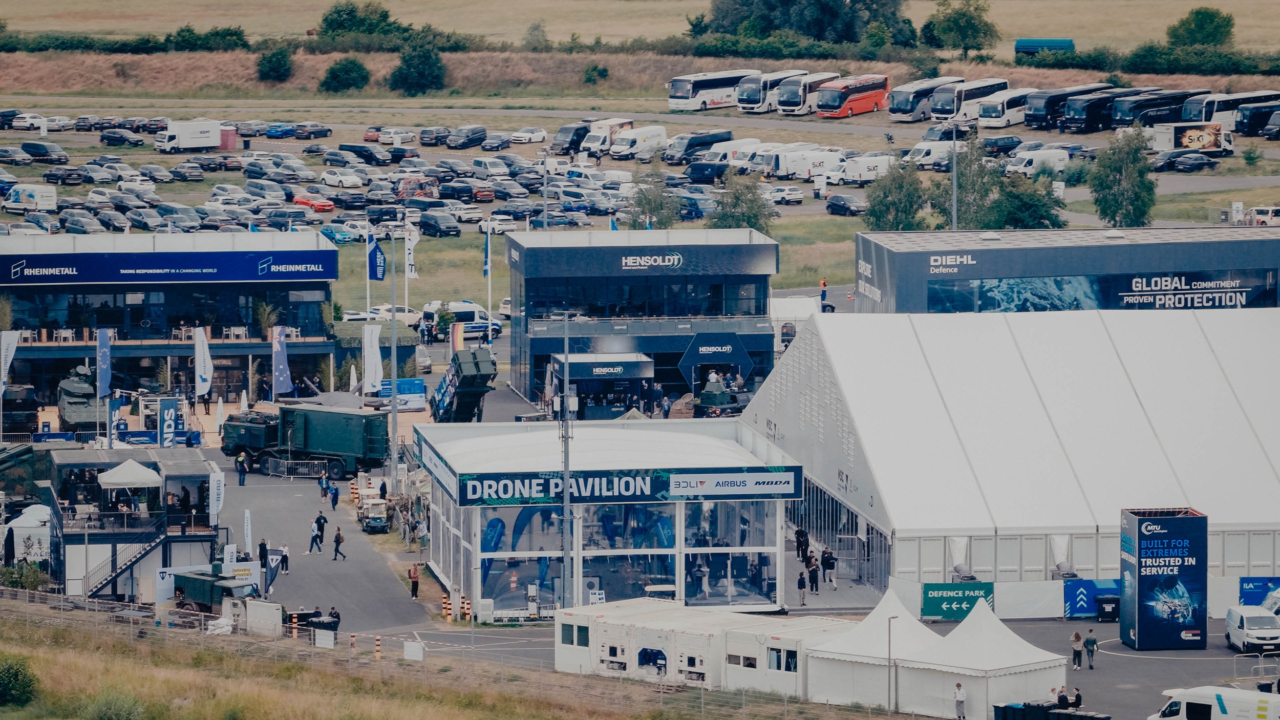 Aerial view of the Drone Pavilion at ILA Berlin 2026: the white tent with its Drone Pavilion banner sits among the outdoor exhibition stands.